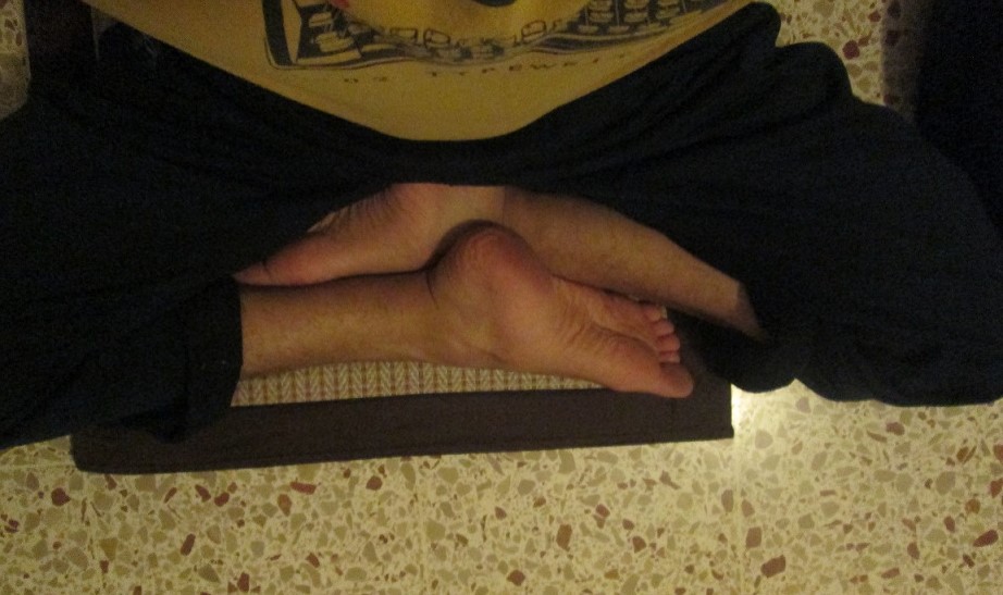 Burmese meditation posture seen from above, showing both legs uncrossed and parallel